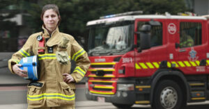 female firefighter in front of Victorian fire and rescue truck
