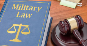 Military Law book with legal gaval